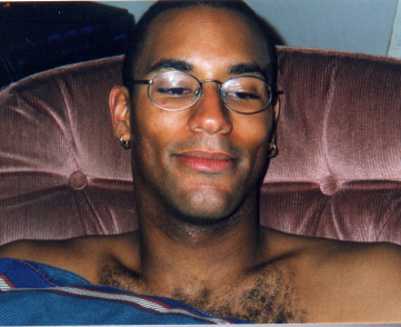 Benjamin Dexback resting in an armchair, smiling at the camera